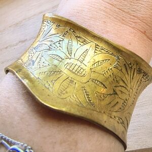 vintage wide, brass-toned bracelet cuff with an etched floral design
